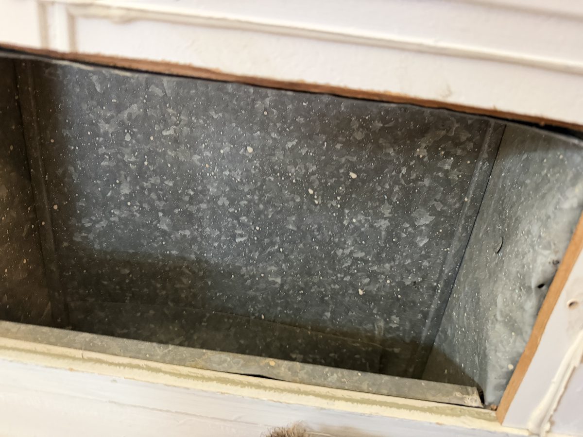The same register box after cleaning, the sheet metal bare