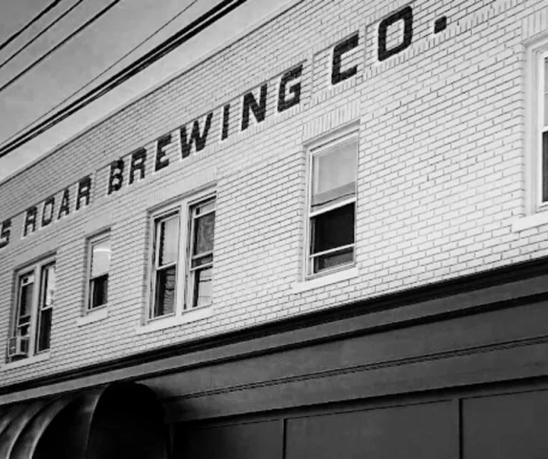 Interior of a modern craft brewery with a community gathering ambiance.