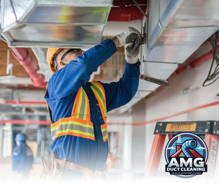 Technician inspecting air ducts for repair