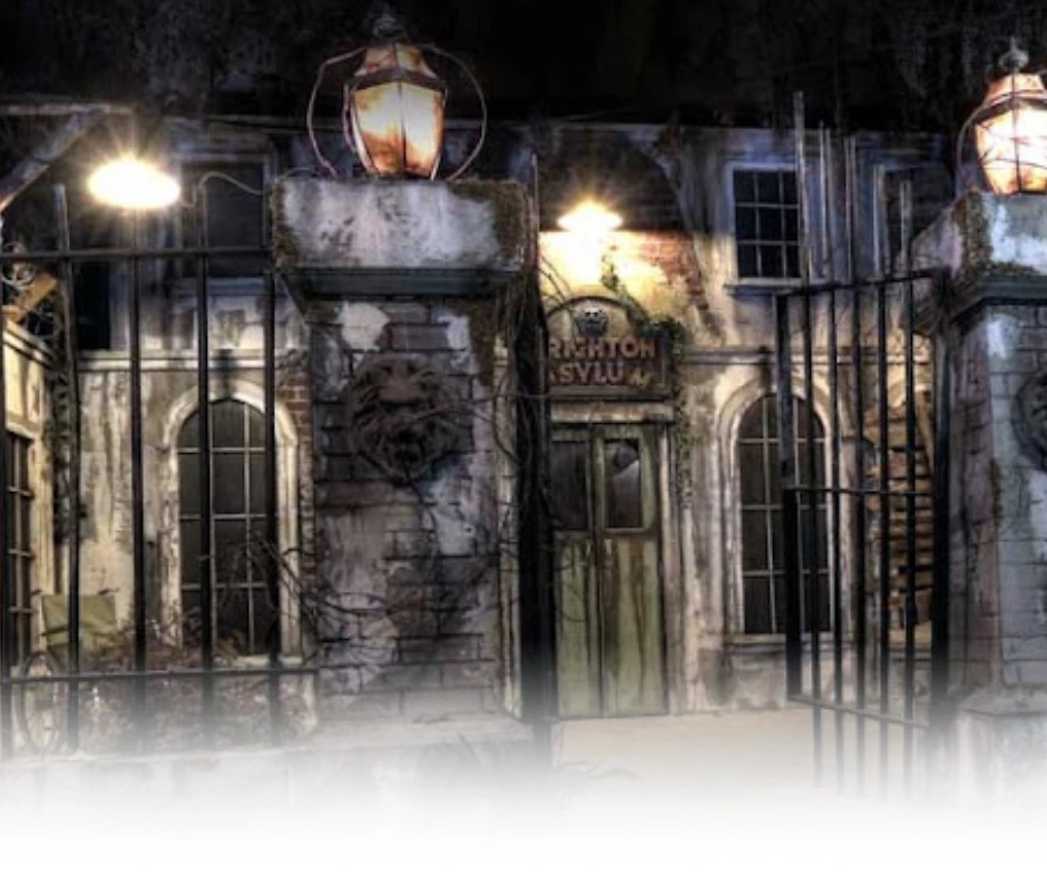Spooky exterior of Brighton Asylum with gothic architecture and dim lighting for a haunted attraction atmosphere in Passaic County, NJ.