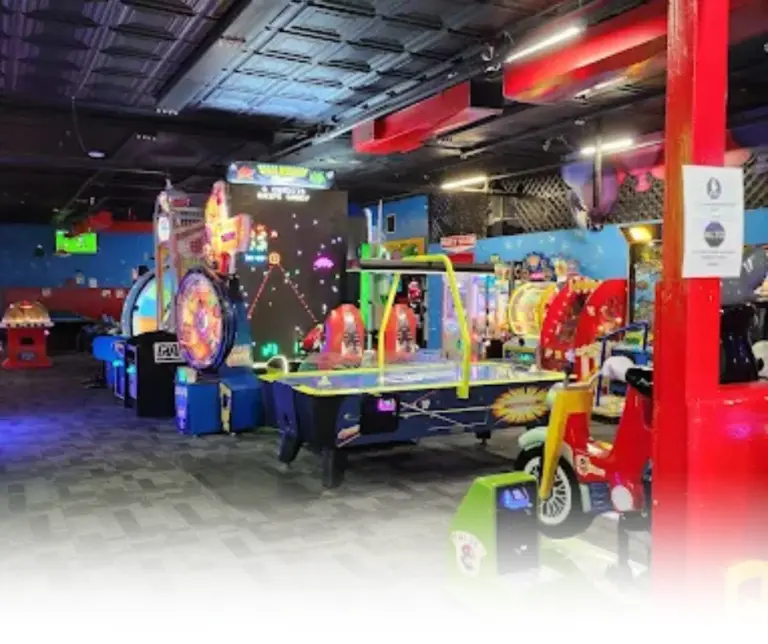Colorful interior of Rack N Roll Family Fun Center with arcade games and children’s rides.